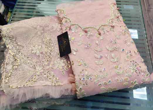 Fancy latkans on daman and sleeves used to enhance 3d flowers, diamonds & original mirror work