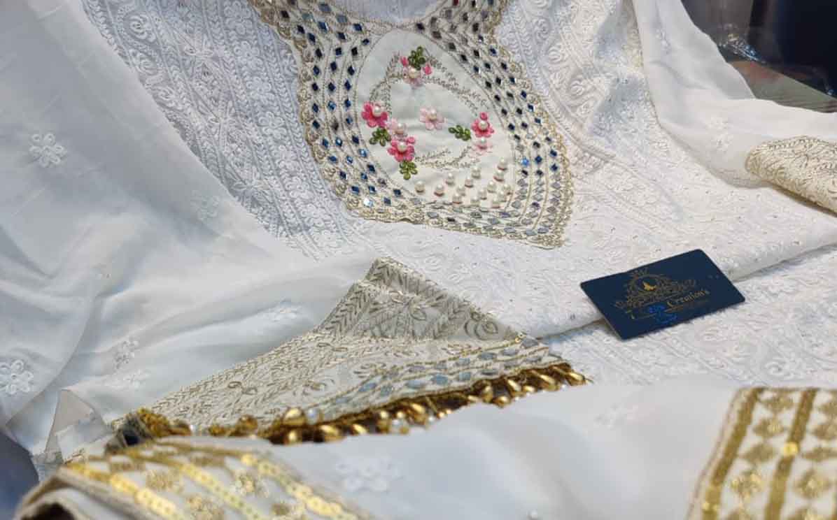 New Stitched Organza with beautiful embroidery, sequins Including sleeves 