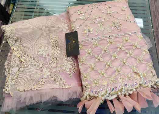 Fancy latkans on daman and sleeves used to enhance 3d flowers, diamonds & original mirror work